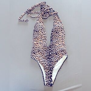 Sexy Leopard Print One Piece Swimsuit. Deep V, wrap around tie. Worn 1x